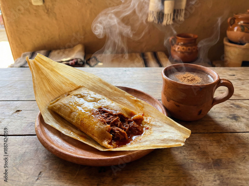 Authentic Mexican Cuisine: Handmade Tamale with Meat Filling and Clay Mug of Warm Beverage
