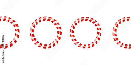 A row of four red and white striped circular objects on black background