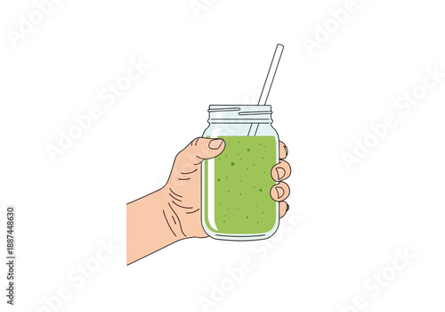 Hand Holding Green Smoothie in Mason Jar with Straw