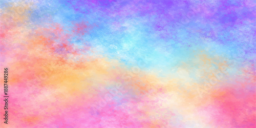 A seamless abstract watercolor background features a bright rainbow spectrum of pastel paint textures and a colorful grunge pattern on paper for a modern wallpaper design