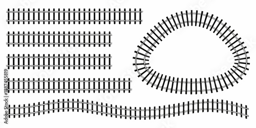 Black and white illustration of various train track configurations and curves