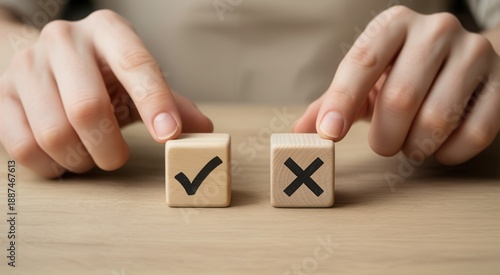 Hands choosing between two wooden blocks with checkmark and cross symbols on a wooden table
