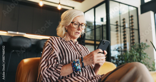 Billede på lærred Home, smartphone and woman on sofa, low angle and message to contact, upset or mistake