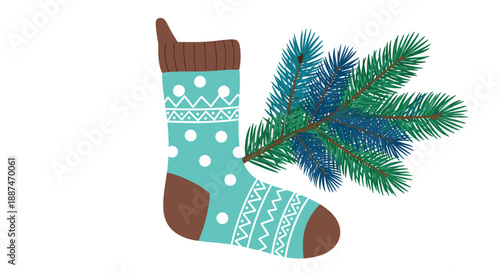 Festive blue Christmas stocking with white patterns placed next to a green pine tree branch on a white background.
