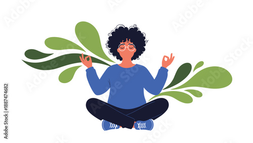 Woman with an afro and glasses sitting in a lotus position meditating peacefully with green leaves in the background.