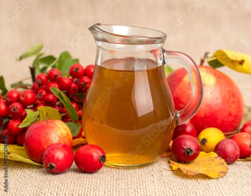 Glass Jug of Apple Cider with Fresh Fruits.