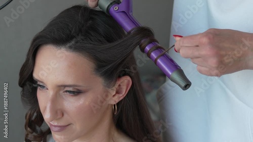 Wallpaper Mural Professional Hair Styling Creates Elegant Curls Using Purple Iron At Beauty Salon. Torontodigital.ca