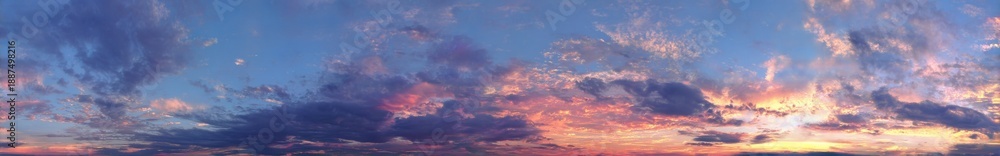 Fototapeta premium Vibrant Sunset Sky with Clouds Over Calm Water Reflecting Golden and Pink Hues