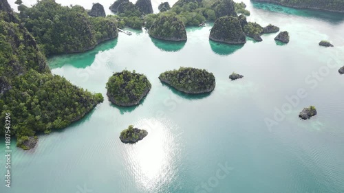 Raja Ampat, Indonesia: Aerial drone footage of the famous wayag viewpoint plateform overlooking a stunning lagoon in in Raja Ampat in west Papua in Indonesia.