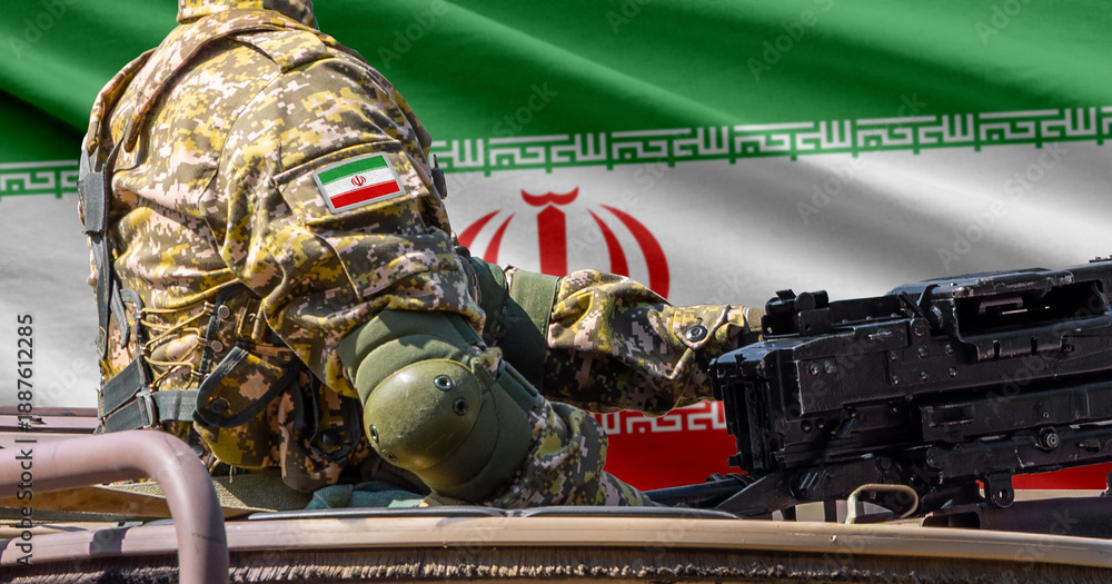 Fototapeta premium Iran flag with soldier at machine gun turret in front of it. Closeup side view.