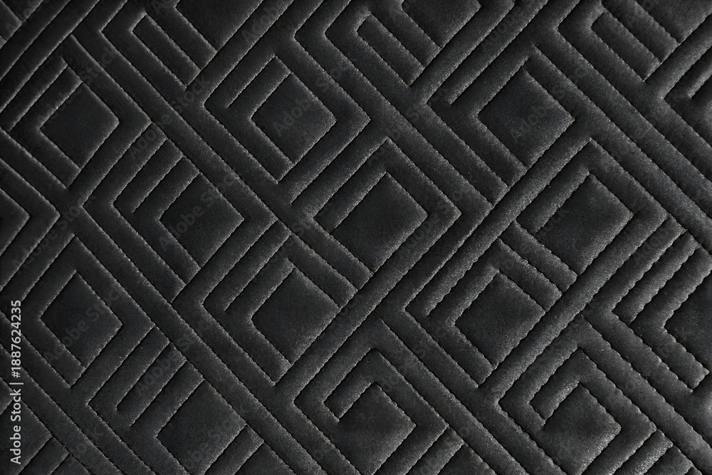 Naklejka premium black quilted faux leather fabric texture background with geometric stitching