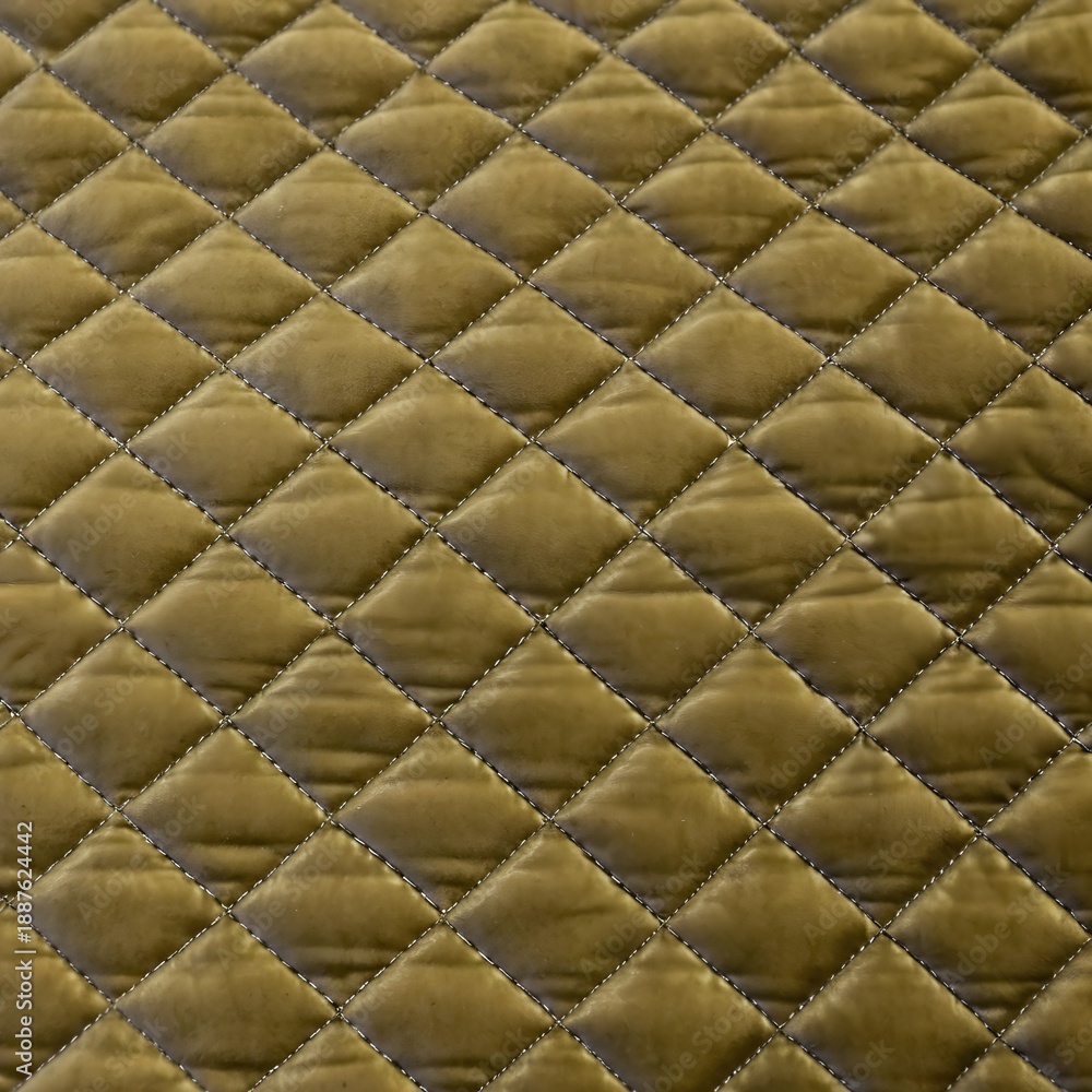 Fototapeta premium Olive green velvet quilted fabric texture with diamond stitching 