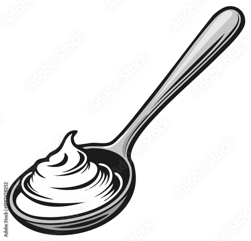A gleaming metal spoon holds a dollop of creamy white whipped topping or frosting artfully swirled