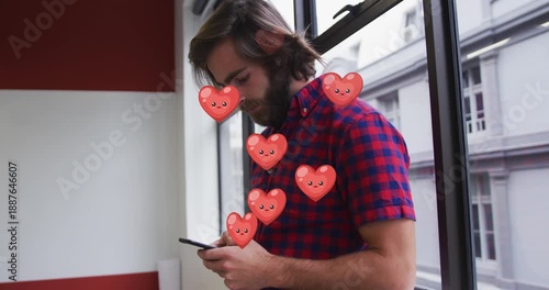 Animation of envelope icons over caucasian woman using smartphone and blank