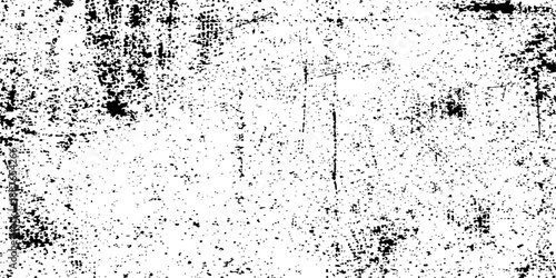 An abstract grunge background featuring a dirty stone wall texture with black ink splatters, paint drops, and a weathered rain surface pattern