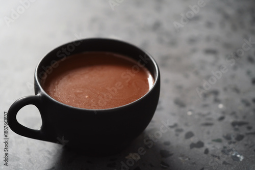 simple cup of hot cocoa drink on terrazzo background