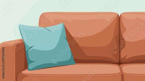 A close up of a tan couch with a blue pillow on it