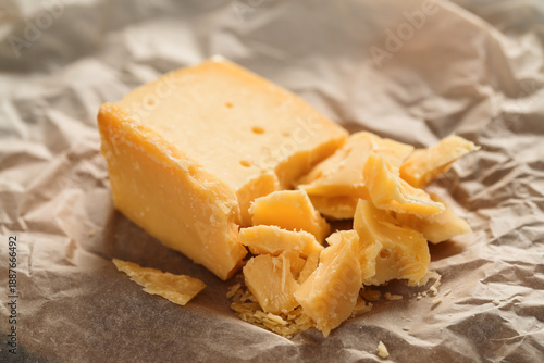 pieces of aged hard cheese on paper