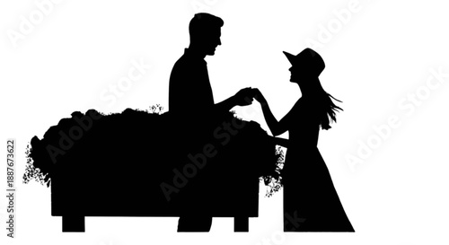 Romantic silhouette of a couple holding hands over a flower bed, symbolizing love and connection