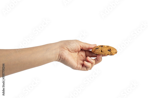 Homemade chocolate almond cookies and hand on transparent background.