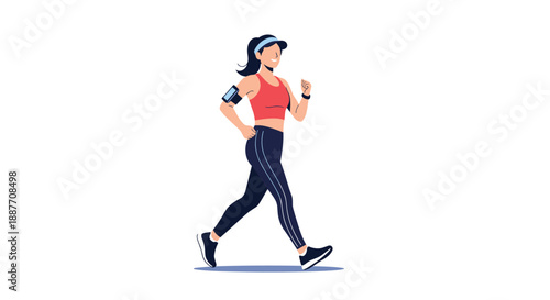 Active woman in a red sports top and dark leggings walks briskly for exercise with her phone attached to a blue armband.