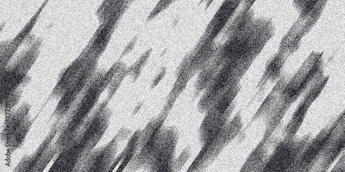 Dynamic diagonal streaks with granular texture and blurred edges creating a sense of movement and abstract energy in monochrome tones