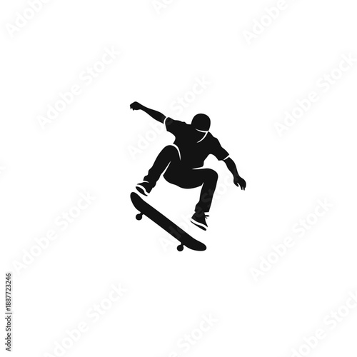Silhouette of a skateboarder performing a trick.