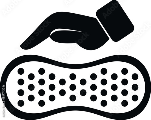 Hand pressing down on a porous sponge, symbolizing scrubbing and hygiene