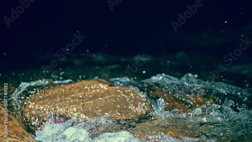 Slow motion ripple waves on dark water river.Amazing dramatic night cinematic backgrounds.Epic mystical magic night view.Underwater stones.Super slow motion detail 4k video.Crystal clear spring river