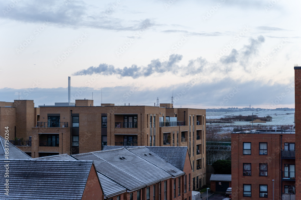 Fototapeta premium Industrial skyline with smoke clouds