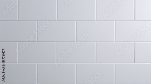 Minimal modern kitchen with white tiled backsplash and seamless grout lines, emphasizing clarity and order. real-estate listings.