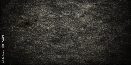 Aged dark grunge texture with a rough black concrete surface and vintage dirty stone pattern provides a blank gray wallpaper backdrop for a weathered material board