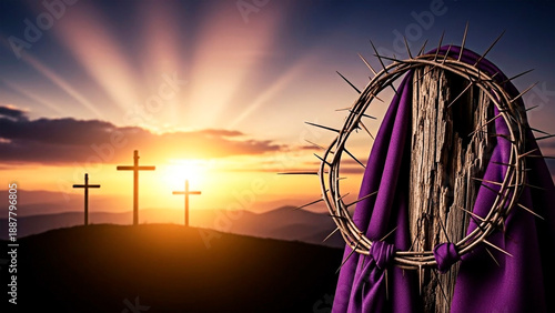 A crown of thorns and purple cloth at sunset with three crosses in the background for the concept of Easter and Christianity