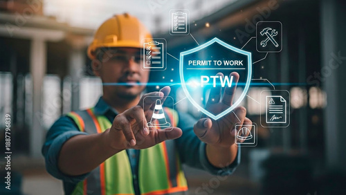 A South Asian man in a construction site interacting with a digital permit to work interface