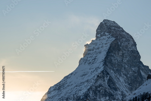 Schilderij op canvas Winter alpine landscape with the Matterhorn peak in Switzerland, showing snow covered mountains and terrain near the Zermatt ski area
