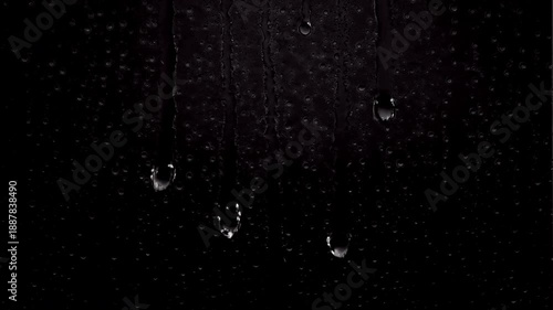 Realistic heavy rain droplets and streaks running down a transparent surface with a clean alpha channel, optimized for atmospheric overlay effects simulating intense weather conditions.