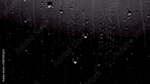 High contrast close-up of heavy rain droplets running down a dark, textured window pane, designed as an isolated cinematic overlay asset with a built-in alpha channel for professional video compositin
