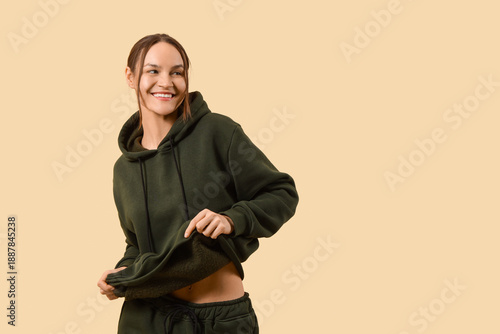 Young woman in green hoodie...