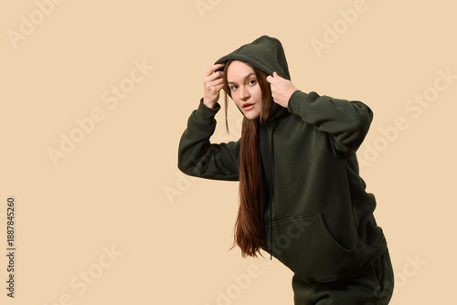 Young woman in green hoodie...