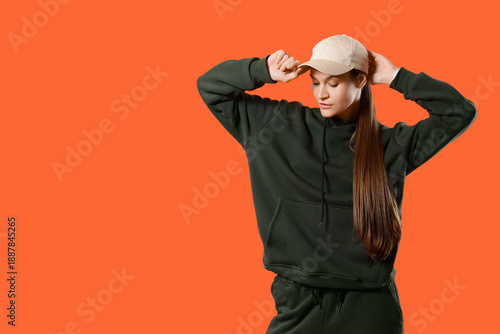 Young woman in sports suit ...