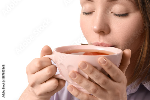 Young woman drinking tea on...