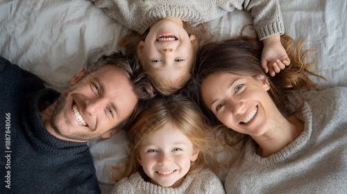 A big happy family lies in a circle and laughs. Close-up. Portrait of a happy family. View from above.