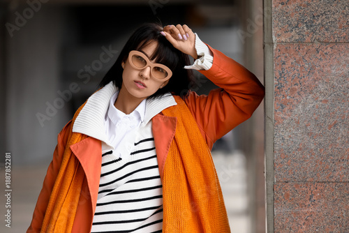 Stylish young woman wearing...
