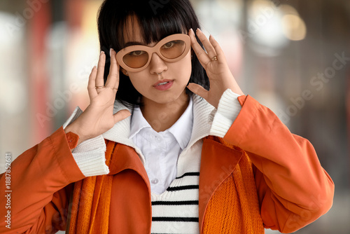 Stylish young woman wearing...