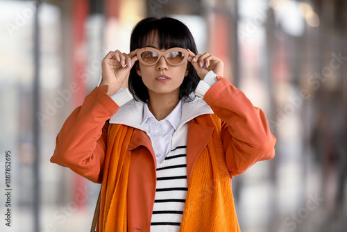 Stylish young woman wearing...