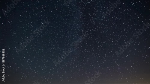 Night sky with stars and aurora borealis viewed from a serene landscape at dusk video