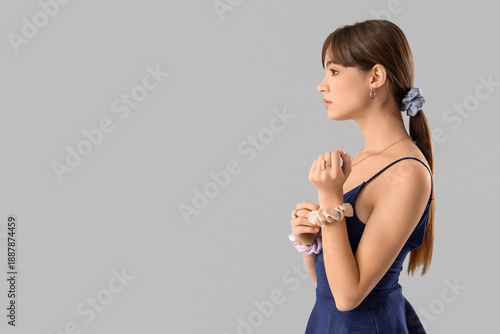 Young woman with ponytail a...