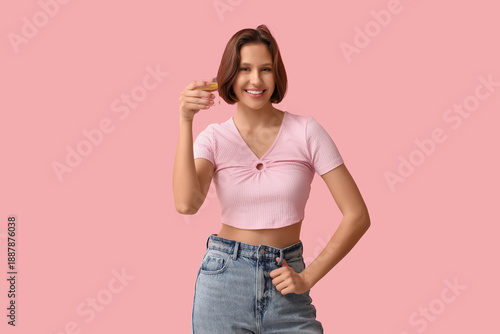 Pretty young woman with gla...