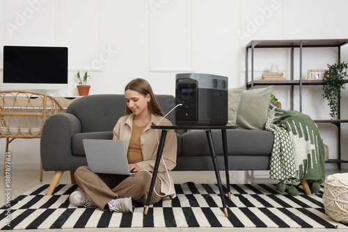 Young woman with portable p...