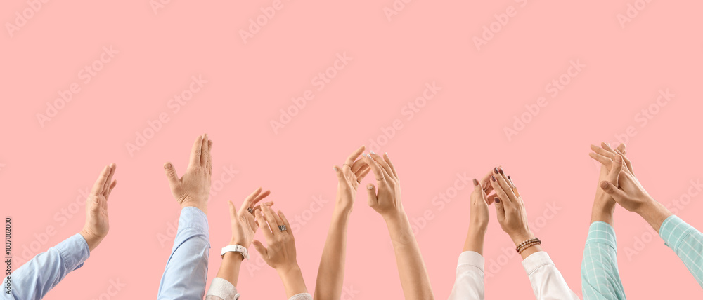 Fototapeta premium Many hands clapping on pink background